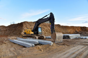 Construction of foundation excavator works in sand pit. 